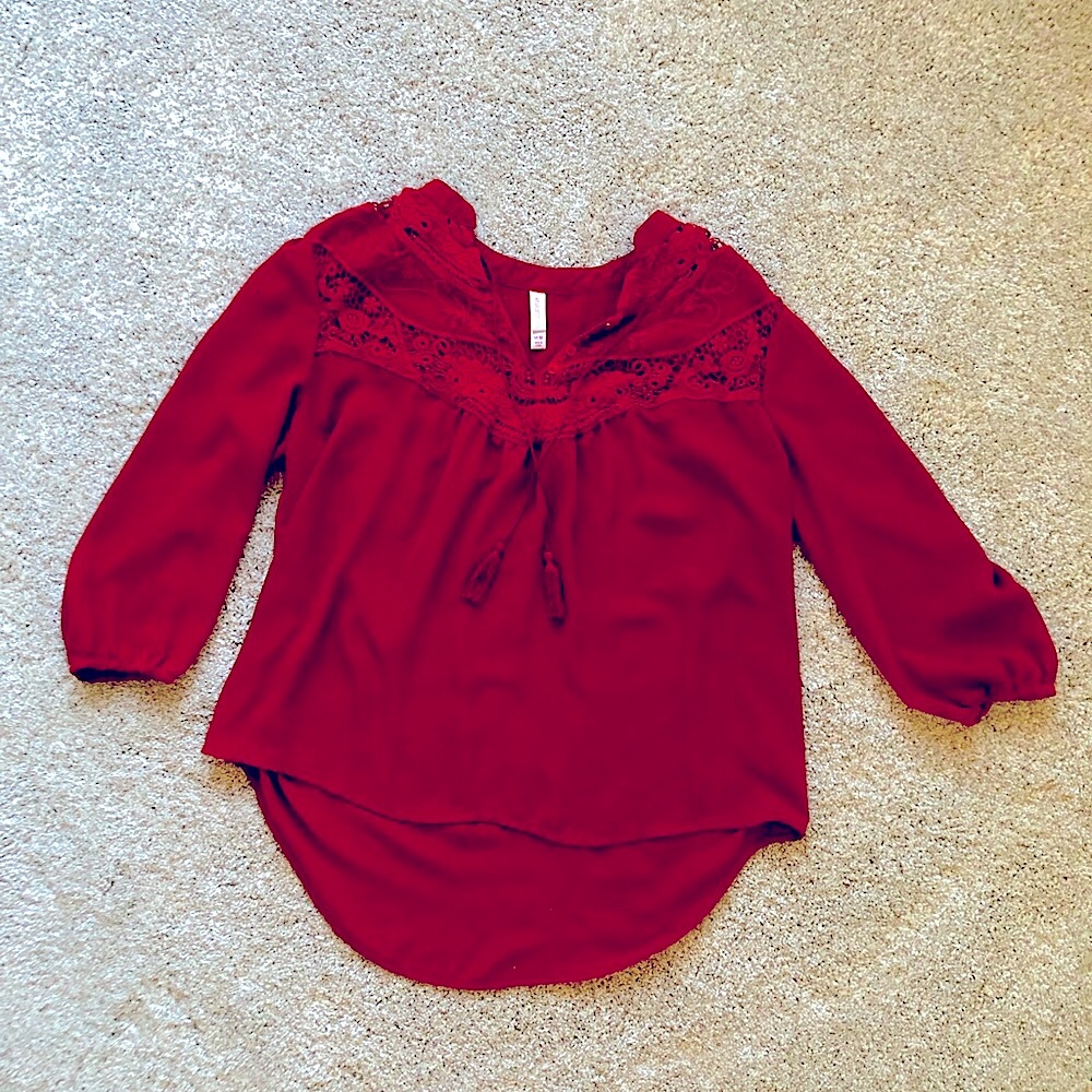 Bohemian chic top with tassels. 3/4 length sleeves. Rust color, flattering fit.